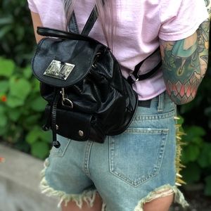 Dolls Kill mini backpack with barcode logo.